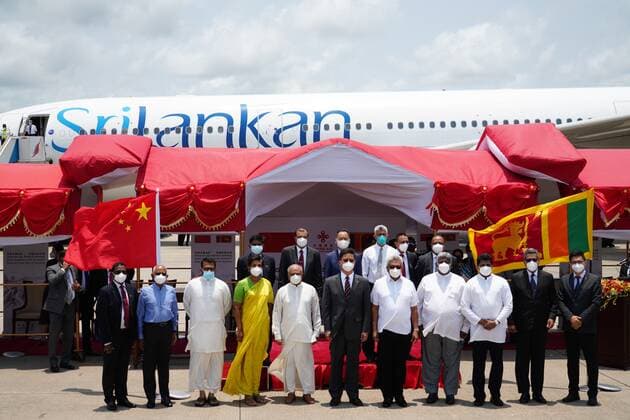 (210401) -- COLOMBO, April 1, 2021 -- Sri Lankan President Gotabaya Rajapaksa (5th R, front ) attends the handover ceremony of Sinopharm COVID-19 vaccines at the Bandaranaike International Airport in Colombo, Sri Lanka, March 31, 2021. A batch of Sinopharm vaccines arrived in Sri Lanka from China on Wednesday as part of a donation by the Chinese government to the island nation. ) SRI LANKA-COLOMBO-CHINA-COVID-19-VACCINES-ARRIVAL TangxLu 