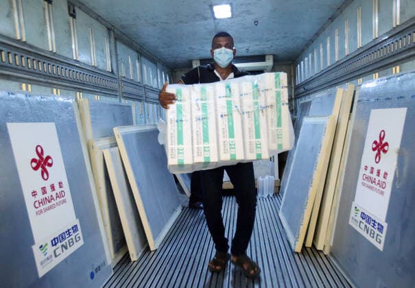 (210401) -- COLOMBO, April 1, 2021 -- A worker unloads Sinopharm COVID-19 vaccines at the Bandaranaike International Airport in Colombo, Sri Lanka, March 31, 2021. A batch of Sinopharm vaccines arrived in Sri Lanka from China on Wednesday as part of a donation by the Chinese government to the island nation. (Photo by Xinhua) SRI LANKA-COLOMBO-CHINA-COVID-19-VACCINES-ARRIVAL AjithxPerera 