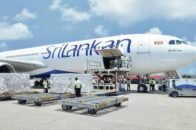 (210401) -- COLOMBO, April 1, 2021 -- Workers transport Sinopharm COVID-19 vaccines at the Bandaranaike International Airport in Colombo, Sri Lanka, March 31, 2021. A batch of Sinopharm vaccines arrived in Sri Lanka from China on Wednesday as part of a donation by the Chinese government to the island nation. ( Handout via Xinhua) SRI LANKA-COLOMBO-CHINA-COVID-19-VACCINES-ARRIVAL SrixLankanxPresidentxMediaxDivision 