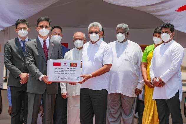(210401) -- COLOMBO, April 1, 2021 -- Sri Lankan President Gotabaya Rajapaksa (4th R, front ) attends the handover ceremony of Sinopharm COVID-19 vaccines at the Bandaranaike International Airport in Colombo, Sri Lanka, March 31, 2021. A batch of Sinopharm vaccines arrived in Sri Lanka from China on Wednesday as part of a donation by the Chinese government to the island nation. ( Handout via Xinhua) SRI LANKA-COLOMBO-CHINA-COVID-19-VACCINES-ARRIVAL SrixLankanxPresidentxMediaxDivision 