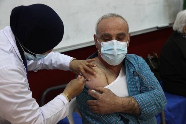 (210401) -- RAMALLAH, April 1, 2021 -- A man receives Sinopharm COVID-19 vaccine during a vaccination campaign in the West Bank city of Ramallah, on April 1, 2021. China on Monday handed over a batch of donated Sinopharm COVID-19 vaccines to Palestine to support its nationwide fight against the pandemic. (Photo by Xinhua) MIDEAST-RAMALLAH-COVID-19-VACCINATION NidalxEshtayeh 