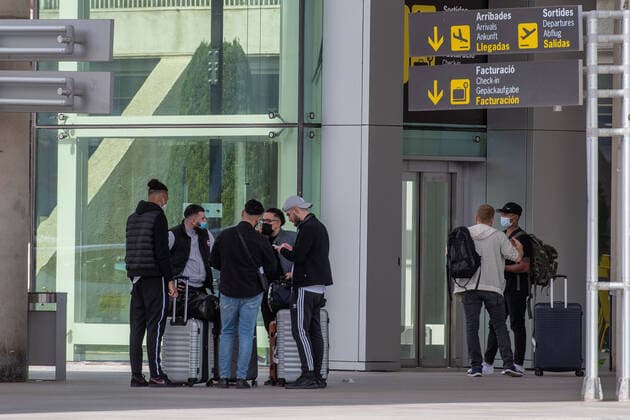 20210401 Tourists arrive at Palma de Mallorca Airport PALMA, SPAIN - APRIL 1 2021 : Tourists at Palma de Mallorca Ariport at - Tourists arrive at Palma de Mallorca Airport on April 1, 2021 in Palma, .
