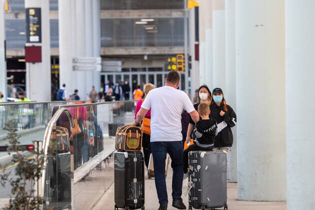 20210401 Tourists arrive at Palma de Mallorca Airport PALMA, SPAIN - APRIL 1 2021 : Tourists at Palma de Mallorca Ariport at - Tourists arrive at Palma de Mallorca Airport on April 1, 2021 in Palma, .