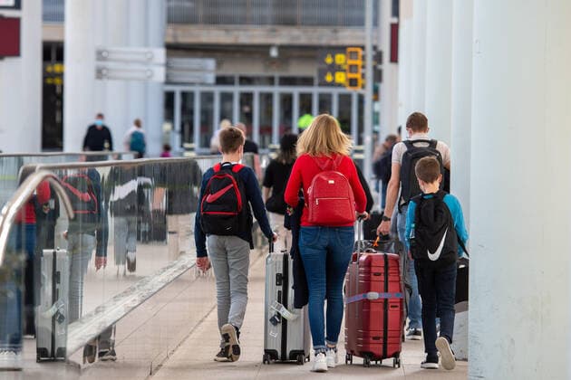 20210401 Tourists arrive at Palma de Mallorca Airport PALMA, SPAIN - APRIL 1 2021 : Tourists at Palma de Mallorca Ariport at - Tourists arrive at Palma de Mallorca Airport on April 1, 2021 in Palma, .