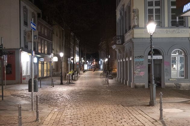 Like an abandoned city. Aachen on Easter vigil between 10 p.m. and 11 p.m. View of the deserted pedestrian zone Am Markt. In Aachen on April 3, 2021. GERMANY - AACHEN - EASTER Easter 2021 Covid Pandemic