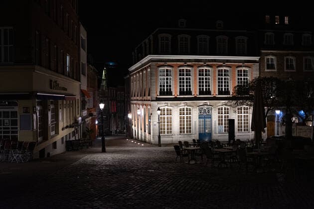Like an abandoned city. Aachen on Easter vigil between 10 p.m. and 11 p.m. The brightly lit Couven Museum stands out from the dark alleys, in Aachen on April 3, 2021. GERMANY - AACHEN - EASTER Easter 2021 Covid Pandemic