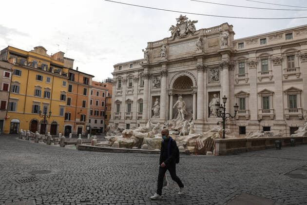 (210404) -- ROME, April 4, 2021 -- A man wearing a face mask walks past Fontana di Trevi in Rome, Italy, April 3, 2021. Italy is spending Easter in lockdown after the government made the whole nation a COVID-19 red zone from Saturday to Easter Monday. ) ITALY-ROME-EASTER-LOCKDOWN ChengxTingting 