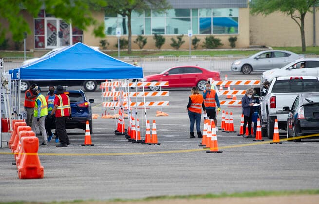 April 03, 2021: Mass drive-thru COVID-19 vaccination site at the Toney Burger Activity Center in South Austin, cars continue to line up on Saturday evening. Austin, Texas. CSM. Austin United States of America - ZUMAc04_ 1001932928st Copyright: xMarioxCantux