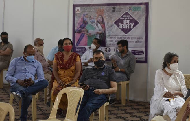 NEW DELHI, INDIA - APRIL 3: people site observation area after a shot of covaxin vaccine during a vaccination drive, at Maulana Azad Institute Of Dental Sciences, on April 3, 2021 in New Delhi, India. (Photo by Sonu Mehta Hindustan Times) India Begins Third Phase Of Vaccination Drive