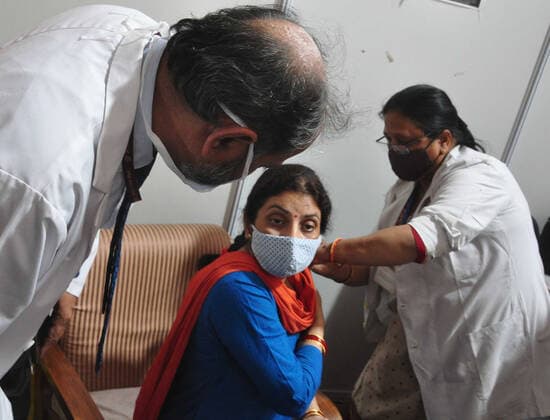 NEW DELHI, INDIA - APRIL 3: Delhi Deputy Chief Minister Manish Sisodia s wife Seema Sisodia receives the first dose of COVID-19 vaccine, during a vaccination drive, at Maulana Azad Institute Of Dental Sciences, on April 3, 2021 in New Delhi, India. (Photo by Sonu Mehta Hindustan Times) India Begins Third Phase Of Vaccination Drive