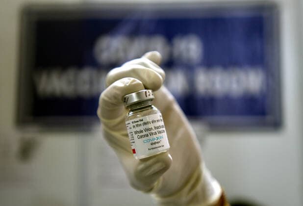 NEW DELHI, INDIA - APRIL 3: A medic prepares a dose of covaxin vaccine during a vaccination drive drive, at Maulana Azad Institute Of Dental Sciences, on April 3, 2021 in New Delhi, India. (Photo by Sonu Mehta Hindustan Times) India Begins Third Phase Of Vaccination Drive