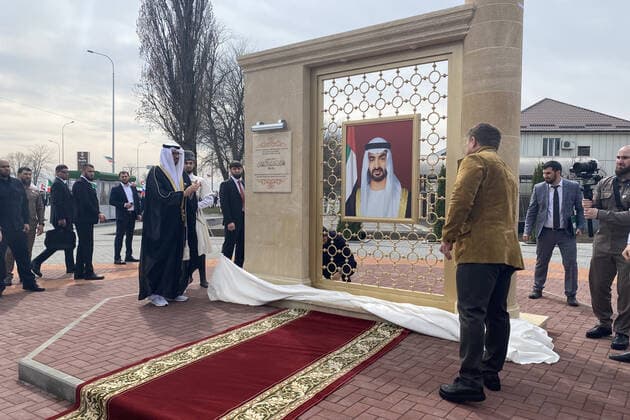 GROZNY, RUSSIA - APRIL 5, 2021: UAE Ambassador to Russia Mohammed Ahmed Al Jaber (L front) and Chechnya Head Ramzan Kadyrov (R front) during the unveiling of a stele with a portrait of Sheikh Mohammed bin Zayed Al Nahyan, Crown Prince of Abu Dhabi, in a street renamed in his honor. Taisiya Borshigova TASS  TS0FBA85