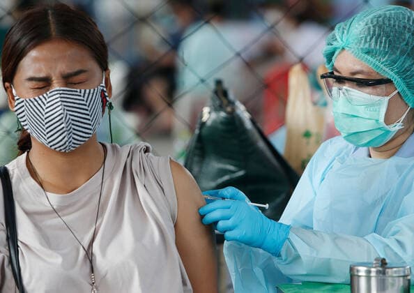 April 7, 2021, Bangkok, Thailand: A woman wearing face mask receives a dose of the CoronaVac (Sinovac) vaccine..Several cabinet ministers and all Bhumjaithai Party MPs have begun 14-day quarantine after being in close contact with new Covid-19 cases. Bangkok Thailand - ZUMAs197 20210407_zaa_s197_014 Copyright: xChaiwatxSubprasomx