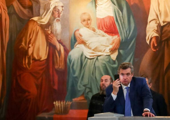MOSCOW, RUSSIA - APRIL 7, 2021: Russian State Duma International Affairs Committee chairman Leonid Slutsky (front) and artistic director of the Mikhailovsky Theater and the Novosibirsk State Academic Opera and Ballet Theater, Vladimir Kekhman attend an Annunciation liturgy at the Cathedral of Christ the Savior. Mikhail Tereshchenko TASS  TS0FBD8A
