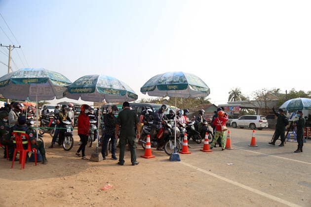 (210407) -- PHNOM PENH, April 7, 2021 -- Police block a road on the border of Kampong Speu province and Kandal province in Cambodia to prevent inter-provincial travel on April 7, 2021. A 14-day ban on travel between provinces started in Cambodia on Wednesday in a bid to stem the spread of COVID-19. The move came after the kingdom saw a rise in daily COVID-19 cases recently. By Tuesday, Cambodia had reported 2,824 confirmed cases of COVID-19 with 22 fatalities and 1,794 recoveries, according to the Ministry of Health. (Photo by Xinhua) CAMBODIA-PHNOM PENH-COVID-19-TRAVEL RESTRICTION LyxLay 