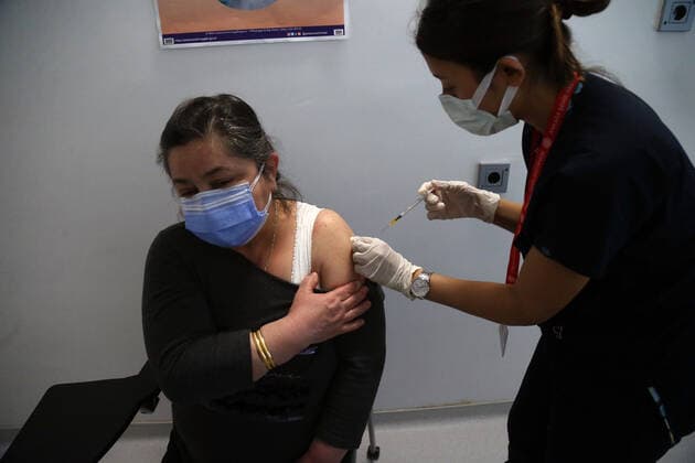 (210407) -- ANKARA, April 7, 2021 -- A woman receives the COVID-19 vaccine in Ankara, Turkey, April 7, 2021. Turkey on Wednesday reported its largest single-day increase in infections with 54,740 new COVID-19 cases, according to its health ministry. (Photo by Xinhua) TURKEY-ANKARA-COVID-19 CASES-SURGE MustafaxKaya