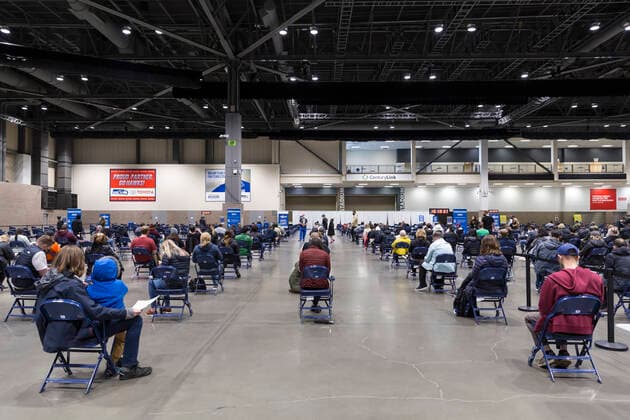 April 7, 2021, Seattle, Washington, USA: Patients wait in the observation area after receiving the first dose of the PfizerÃ¢â‚¬BioNTech COVID-19 vaccine at the Lumen Field Event Center in Seattle on Wednesday, April 7, 2021. The City of Seattle administered a record 7,615 doses of vaccine at the site on Wednesday. Seattle USA - ZUMAg235 20210407_zap_g235_021 Copyright: xPaulxChristianxGordonx