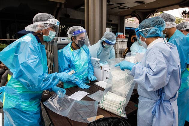 April 8, 2021, Bangkok, Thailand: Health workers dressed in protective suits prepare equipment during a swab test drive outside a nightclub in Bangkok..The Ministry of Public Health is set to recommend the closure of night entertainment spots in high-risk areas of Bangkok, in order to deal with the fast-spreading UK variant of the coronavirus. The UK variant is believed to have played a significant role in the spread of the latest cluster of infections detected at entertainment venues across the capital. Bangkok Thailand - ZUMAs197 20210408_zaa_s197_012 Copyright: xChaiwatxSubprasomx
