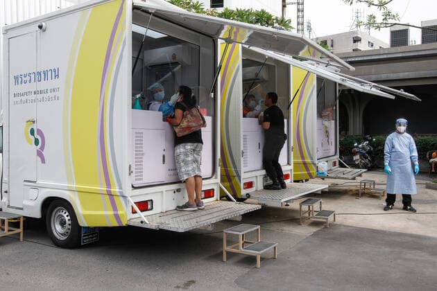 April 8, 2021, Bangkok, Thailand: Health workers collect nasal swab sample from a woman outside a nightclub in Bangkok..The Ministry of Public Health is set to recommend the closure of night entertainment spots in high-risk areas of Bangkok, in order to deal with the fast-spreading UK variant of the coronavirus. The UK variant is believed to have played a significant role in the spread of the latest cluster of infections detected at entertainment venues across the capital. Bangkok Thailand - ZUMAs197 20210408_zaa_s197_016 Copyright: xChaiwatxSubprasomx