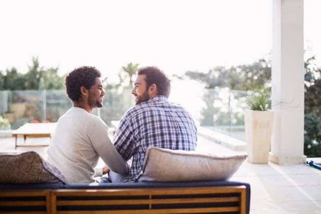 Happy couple sitting on sofa Happy couple sitting on sofa in terrace, model released, Cape Town, South Africa, 01.09.2015, 632879.jpg, home, lifestyle, leisure, domestic life, casual clothing, handsome, shirt, homosexual couple, gay man, homosexual, couple, relationship, together, love, affection, natural, happy, smiling, cheerful, couch, sofa, patio, garden, sunny, bright, spring, summer, weekend, free time, free, freedom, carefree, escapism 20s, Young Adult, Man, Male, Caucasian, Mixed-Race, 25-29 Years, Young Men, Caucasian Ethnicity, 20-24 Years, Mixed-Race Person Outdoors,Day