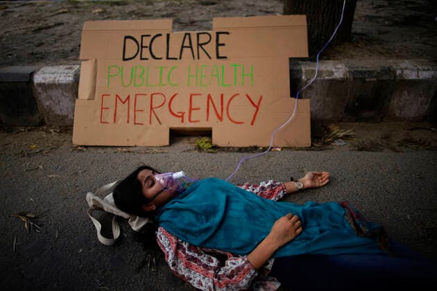 April 8, 2021, Kathmandu, Nepal: An environment activist wearing a oxygen mask tied to a tree takes part in a protest to declare climate emergency and public health emergency as the air pollution fluctuates to hazardous levels due to recent wildfires across the country in Kathmandu, Nepal on Thursday, April 8, 2021. Kathmandu Nepal - ZUMAg200 20210408_zap_g200_001 Copyright: xSkandaxGautamx
