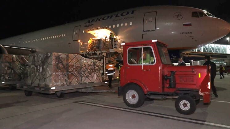 YEREVAN, ARMENIA - APRIL 8, 2021: The first batch of the Gam-COVID-Vac (Sputnik V) COVID-19 vaccine (15,000 doses) is loaded on a vehicle at Zvartnots International Airport. The vaccine will be used for vaccination of people at risk of severe COVID-19 illness. Best quality available. Video screen grab. The Republic of Armenia Ministry of Health TASS A STILL IMAGE TAKEN FROM VIDEO PROVIDED BY A THIRD PARTY. EDITORIAL USE ONLY  TS0FBF62
