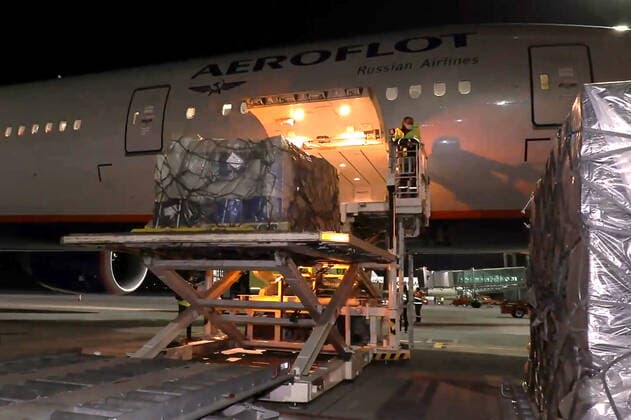 YEREVAN, ARMENIA - APRIL 8, 2021: Unloading the first batch of the Gam-COVID-Vac (Sputnik V) COVID-19 vaccine (15,000 doses) from an Aeroflot - Russian Airlines plane at Zvartnots International Airport. The vaccine will be used for vaccination of people at risk of severe COVID-19 illness. Best quality available. Video screen grab. The Republic of Armenia Ministry of Health TASS A STILL IMAGE TAKEN FROM VIDEO PROVIDED BY A THIRD PARTY. EDITORIAL USE ONLY  TS0FBF63