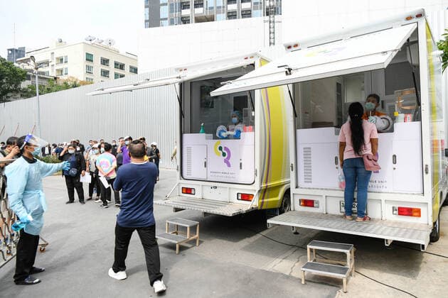 April 8, 2021, Bangkok, Thailand: A health worker collects a nasal swab sample from a woman outside a nightclub in Bangkok..The Ministry of Public Health is set to recommend the closure of night entertainment spots in high-risk areas of Bangkok, in order to deal with the fast-spreading UK variant of the coronavirus. The UK variant is believed to have played a significant role in the spread of the latest cluster of infections detected at entertainment venues across the capital. Bangkok Thailand - ZUMAs197 20210408_zaa_s197_070 Copyright: xAmpholxThongmueangluangx