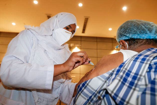 April 8, 2021, Dhaka, Bangladesh: A man receives a dose of Covid-19 coronavirus vaccine during second phase of Covid-19 vaccination drive at the Bangabandhu Sheikh Mujib Medical University (BSMMU) in Dhaka, Bangladesh, April 8, 2021. The government is supposed to get 5 million doses of the Oxford-AstraZeneca vaccine every month as per a deal between India s Serum Institute and Bangladeshi pharma company Beximco. The country has so far received two shipments of 7 million doses of the Covid-19 vaccine. Apart from this, Bangladesh received two consignments of 3.2 million doses of the vaccine as gifts from India. Dhaka Bangladesh - ZUMAd117 20210408_zap_d117_004 Copyright: xSuvraxKantixDasx