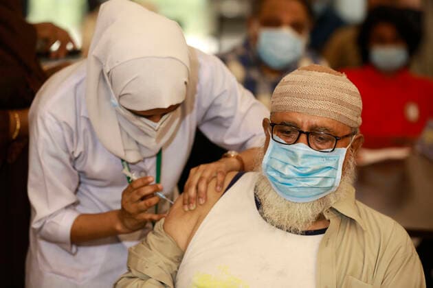 April 8, 2021, Dhaka, Bangladesh: A man receives a dose of Covid-19 coronavirus vaccine during second phase of Covid-19 vaccination drive at the Bangabandhu Sheikh Mujib Medical University (BSMMU) in Dhaka, Bangladesh. The government is supposed to get 5 million doses of the Oxford-AstraZeneca vaccine every month as per a deal between India s Serum Institute and Bangladeshi pharma company Beximco. The country has so far received two shipments of 7 million doses of the Covid-19 vaccine. Apart from this, Bangladesh received two consignments of 3.2 million doses of the vaccine as gifts from India. Dhaka Bangladesh - ZUMAd117 20210408_zap_d117_011 Copyright: xSuvraxKantixDasx