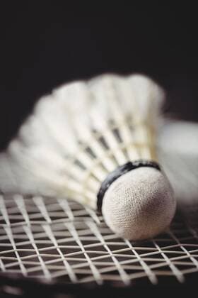 Close up of shuttlecock and badminton racket Close up of shuttlecock and badminton racket, model released, Cork, Ireland, 15.01.2016, 682675.jpg, black, background, sport, badminton, racket, shuttlecock, game, sportswear, launches, success, amusement, enjoyment, joy, pleasure, enjoying, having, fun, amusing, entertaining, gesture, hands, victory, triumph, accomplishment, cheering, olympic, olympics, sporty, active, athletic, competition