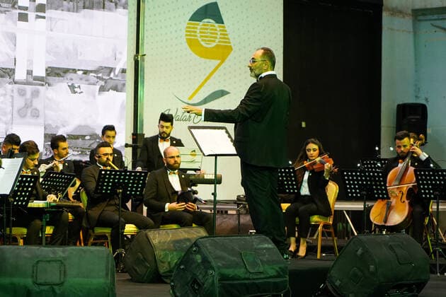 April 8, 2021, Mosul, Nineveh, Iraq: Members of the Watar orchestra playing for the first time on the grounds of the Spring Theatre Hall, which was destroyed during the ISIS occupation in the city..The Watar orchestral includes 36 young men and women from different denominations of Nineveh Governorate, including Muslims, Christians and Yazidis, whose ages range between 8-32 years. Mosul Iraq - ZUMAs197 20210408_zaa_s197_169 Copyright: xIsmaelxAdnanx