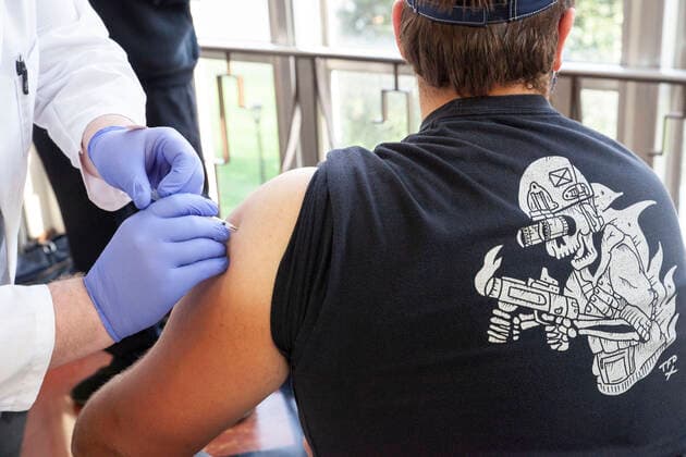 April 8, 2021, Charleston, West Virginia, United States: A student receives the vaccine in Riggleman Hall..The Kanawha-Charleston Health Department led a vaccination effort on the campus of the University of Charleston. 1,800 doses of the Johnson & Johnson Janssen Covid-19 vaccine were on hand to be given out to all persons aged 16 years and older. Charleston United States - ZUMAs197 20210408_zaa_s197_239 Copyright: xStephenxZennerx
