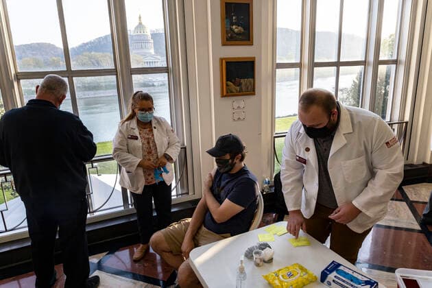 April 8, 2021, Charleston, West Virginia, United States: Health Professionals prepare to vaccinate a student in Riggleman Hall..The Kanawha-Charleston Health Department led a vaccination effort on the campus of the University of Charleston. 1,800 doses of the Johnson & Johnson Janssen Covid-19 vaccine were on hand to be given out to all persons aged 16 years and older. Charleston United States - ZUMAs197 20210408_zaa_s197_241 Copyright: xStephenxZennerx