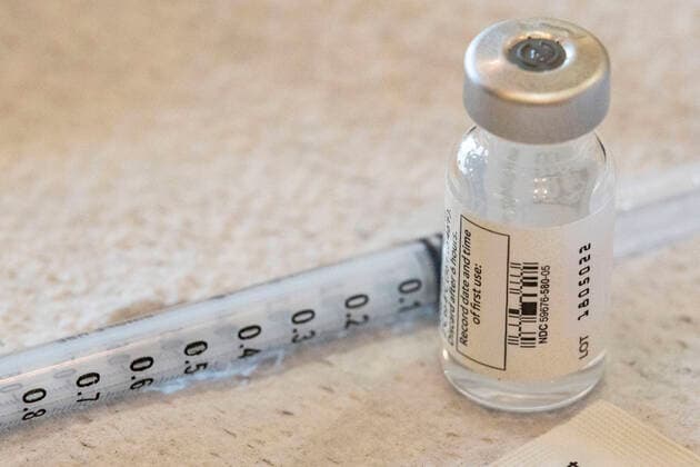 April 8, 2021, Charleston, West Virginia, United States: Vial of the vaccine lies next to a syringe during the vaccination in Riggleman Hall..The Kanawha-Charleston Health Department led a vaccination effort on the campus of the University of Charleston. 1,800 doses of the Johnson & Johnson Janssen Covid-19 vaccine were on hand to be given out to all persons aged 16 years and older. Charleston United States - ZUMAs197 20210408_zaa_s197_250 Copyright: xStephenxZennerx