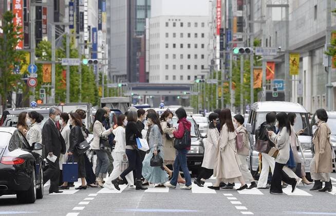 Tokyo, Kyoto, Okinawa to step up anti-COVID measures People wearing face masks to protect against the novel coronavirus walk in Tokyo on April 9, 2021. The Japanese government designated Tokyo and Kyoto and Okinawa prefectures the same day as requiring stronger measures to fight COVID-19 amid a resurgence in infections, less than three weeks after fully lifting a state of emergency. 