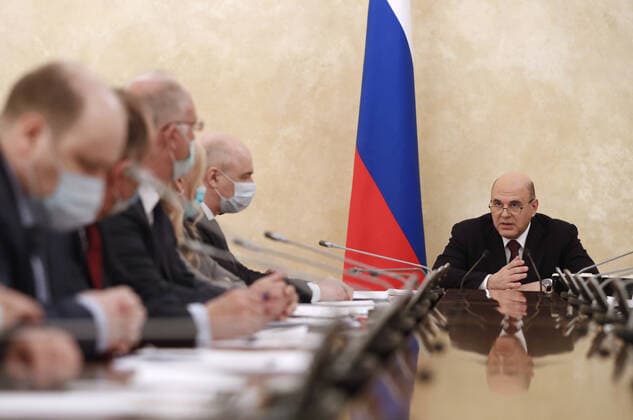 MOSCOW, RUSSIA - APRIL 9, 2021: Russia s Prime Minister Mikhail Mishustin (R) during a meeting on the production and circulation of vaccines against COVID-19 at the House of the Russian Government. Dmitry Astakhov POOL TASS  TS0FC1A0