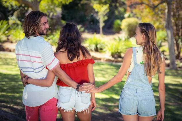 Man cheating on her woman in park Rear view of man cheating on her woman in park while walking, model released, Cork, Ireland, 20.07.2016, 800630.jpg, couple, relationship, park, parkland, tree, sunlight, countryside, summer, sunny, casual clothing, walking, smiling, cheerful, happy, holding hands, infidelity, cheating, cheater, unfaithful, unaware, oblivious, vacation, holiday, recreation, weekend activities, travel, together, bonding, love, care, closeness, affection, fondness, handsome, beautiful, pretty Outdoors,Day