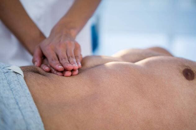 Physiotherapist giving stomach massage to a man Physiotherapist giving stomach massage to a man in clinic, model released, Cape Town, South Africa, 01.06.2016, 805224.jpg, medical, clinic, hospital, practitioner, doctor, specialist, physio, therapist, physical therapist, physiotherapist, physiotherapy, osteopath, orthopedic, chiropractor, patient, lying, standing, pressing, stomach massage, massage, massaging, acupressure, stomach, abdomen, kidney, suffering, stressed, illness, sick, pain, physical injury, relief, relaxation, treatment, healing, wellness, care, cure, recovery, health service, healthcare, bodycare, healthcare and medicine, occupation, expertise, profession, professional, guidance Baby, Girl, Female, Mixed-Race, 30s, Mid Ad