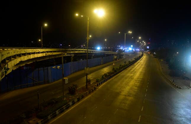 MUMBAI, INDIA - APRIL 9: Marine Drive deserted after night curfew and a weekend lockdown came into effect on April 9, 2021 in Mumbai, India. Amid an alarming spike in COVID-19 cases in Mumbai, night curfew and weekend lockdown had been announced in the country s financial capital to curb the spread of COVID-19 infections. (Photo by Anshuman Poyrekar Hindustan Times) Night Curfew And Weekend Lockdown Imposed In Mumbai To Curb The Spread Of Covid-19 Infections