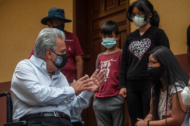April 9, 2021, Quito, Pichincha, Ecuador: President of Ecuador, Lenin Moreno wearing a facemask speaks with residents during the first phase of Covid19 vaccination in Quito..The first phase of COVID19 Vaccination in Ecuador has been carried out starting with persons with disabilities. This vaccination program is designed to reach their homes, on this occasion the beneficiary was Camita Quichuela, a 41-year-old woman who has 80% intellectual disability (ID) and is totally dependent on the care of her mother. The President of Ecuador Lenin Moreno was present at the event. Quito Ecuador - ZUMAs197 20210409_zaa_s197_276 Copyright: xJuanxDiegoxMontenegrox