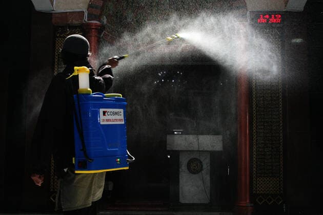 Indonesia: Mosque sanitization to welcome the holy month of Ramadan A resident sprays disinfectant liquid at one of the mosques in the Pondok Gede residential area, Bekasi, West Java. Spraying disinfectant liquid and cleaning the mosque in order to welcome the holy month of Ramadan so that the mosque is in a clean and sterile condition from the spread of the Corona virus (Covid-19) when it is used by residents during worship and activities in the mosque area. Bekasi West Java Indonesia Copyright: KuncoroxWidyoxRumpoko