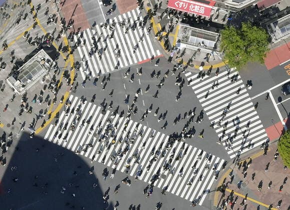 Japan s fight against novel coronavirus Photo taken from a Kyodo News helicopter shows people crossing the famous scramble intersection near Shibuya Station in Tokyo on April 10, 2021, amid the continued spread of the novel coronavirus. 