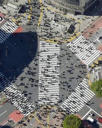 Japan s fight against novel coronavirus Photo taken from a Kyodo News helicopter shows people crossing the famous scramble intersection near Shibuya Station in Tokyo on April 10, 2021, amid the continued spread of the novel coronavirus. 