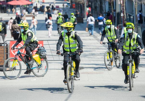April 10, 2021, Montreal, PQ, Canada: Police officers patrol Sainte-Catherine Street in Montreal, Saturday, April 10, 2021, as the COVID-19 pandemic continues in Canada and around the world. Montreal Canada  - ZUMAc35_ 20210410_zaf_c35_009 Copyright: xGrahamxHughesx