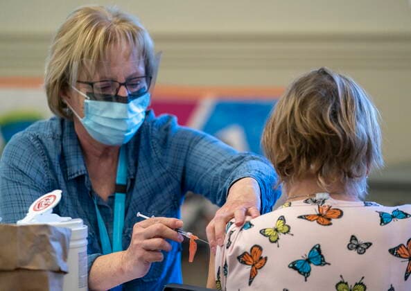 April 10, 2021, Richmond, BC, Canada: A person receives a COVID-19 vaccine at a vaccination clinic run by Vancouver Coastal Health, in Richmond, B.C., Saturday, April 10, 2021. Richmond Canada  - ZUMAc35_ 20210410_zaf_c35_033 Copyright: xJonathanxHaywardx