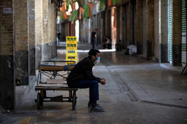(210410) -- TEHRAN, April 10, 2021 -- A worker sits on his cart at the Grand Bazaar in Tehran, Iran, April 10, 2021. Iran on Saturday enforced a 10-day restriction throughout the country to curb the recent resurgence of coronavirus cases and deaths. (Photo by Xinhua) IRAN-TEHRAN-COVID-19-NATIONWIDE RESTRICTIONS-IMPOSED AhmadxHalabisaz 