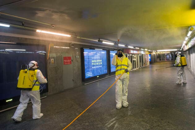 April 11, 2021, Warsaw, Poland: Cleaning service workers wearing protective suits are seen disinfecting one of the most frequently used underpass in Warsaw..At night, the municipal cleaning services disinfect the most important and most frequently used communication routes in the center of Warsaw. Disinfection was carried out with highly ozonated water - it is an innovative Polish method..Disinfection of Warsaw was performed due to the covid 19 pandemic, the third wave of the virus is currently raging in Poland, there is a shortage of places in hospitals and the average daily number of new cases is around 30,000, while deaths are over 600. Warsaw Poland - ZUMAs197 20210411_zaa_s197_005 Copyright: xAttilaxHusejnowx