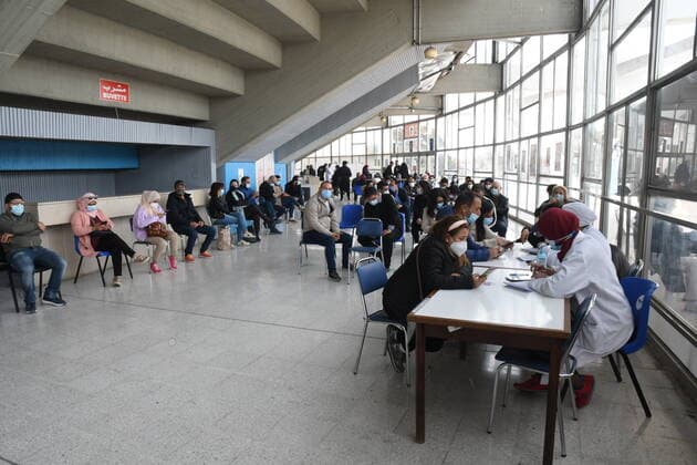 (210411) -- TUNIS, April 11, 2021 -- People register to receive COVID-19 vaccines at a vaccination center in a gymnasium in Tunis, Tunisia, April 10, 2010. (Photo by Xinhua) TUNISIA-TUNIS-COVID-19-VACCINATION AdelxEzzine 