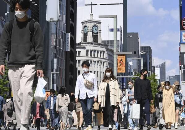 Japan s fight against novel coronavirus People wearing masks to protect against the novel coronavirus walk in Tokyo s Ginza shopping district on April 11, 2021, a day before quasi-emergency measures against the virus officially commence in the capital. 